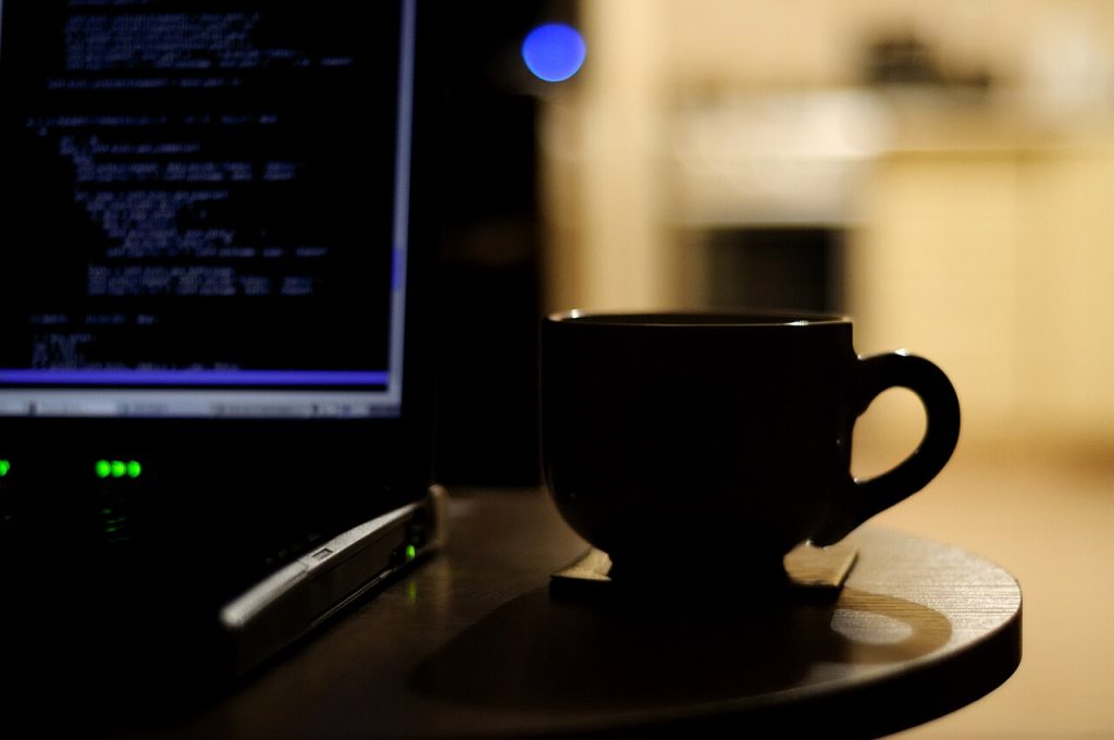 Person working on a computer screen late at night