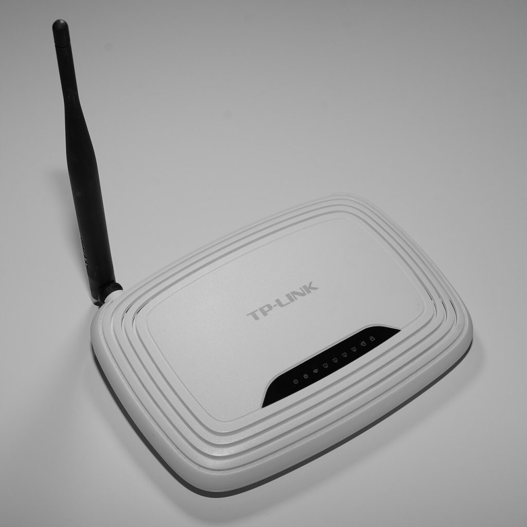 Home Wi-Fi router with antennas on a shelf