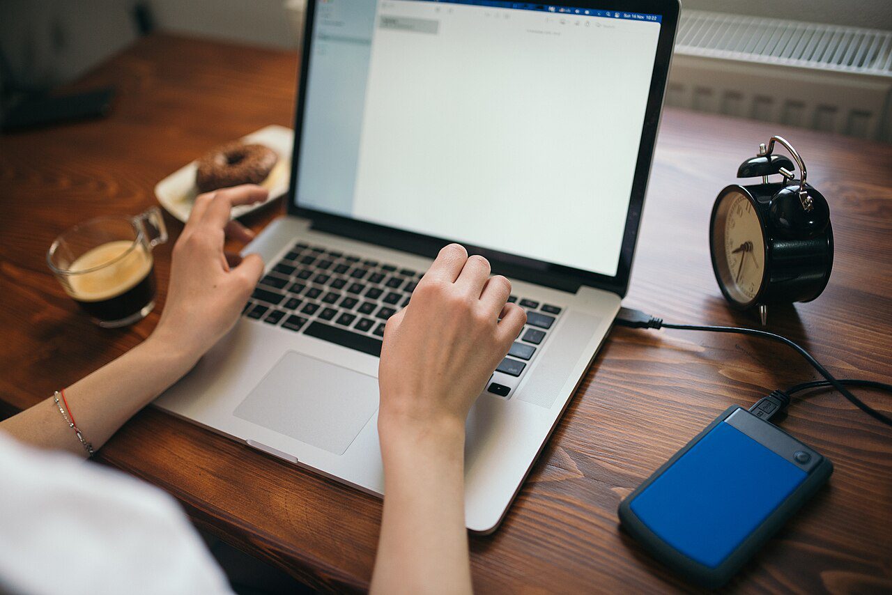 External hard drive connected to a laptop for family backups