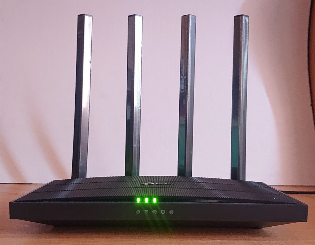 A home Wi-Fi router with antennas ready for firmware updates