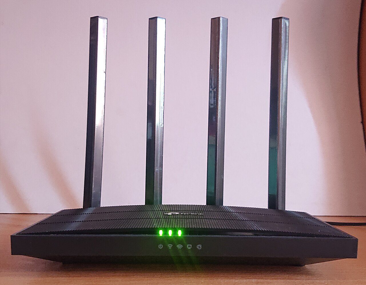 A home Wi-Fi router with antennas ready for firmware updates